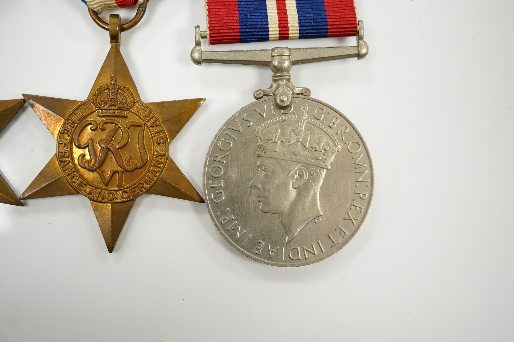 Seven military medals, including; a WWII medal group including the 1939-1945 Star, the France and Germany Star and the 1939-1945 Medal, a George V General Service Medal with a bar for Iraq awarded to GNR. G. Fuller R.A.